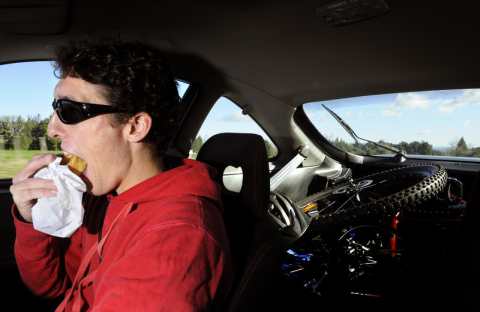 A man eating while driving