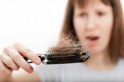 Girl watching in the comb her hair loss